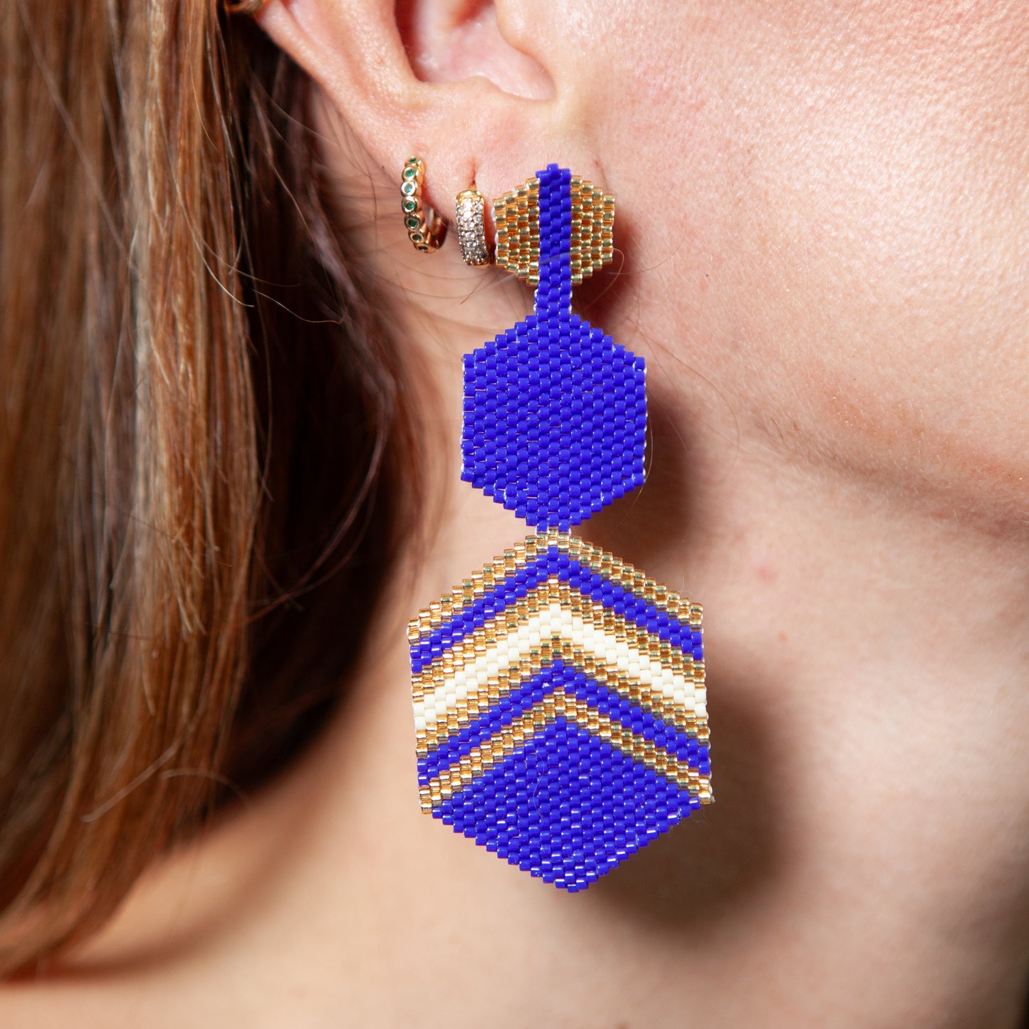 These earrings are handcrafted with Miyuki beads, making them both lightweight and comfortable to wear. The bronze stud with gold plating adds a touch of elegance and sophistication to any outfit