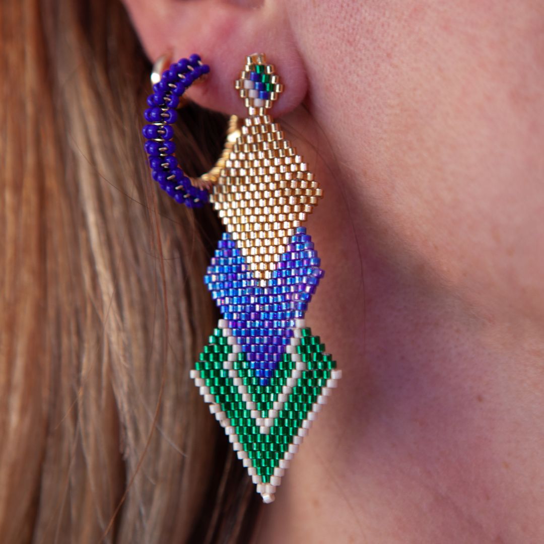 Elevate your style with our Triple Rhombus Earrings. Expertly handcrafted with intricate beadwork on fine wire, these earrings feature a stunning bronze stud with gold plating. Elevate your look and add a touch of luxury with our unique earrings, available in various colors to suit your personal taste.