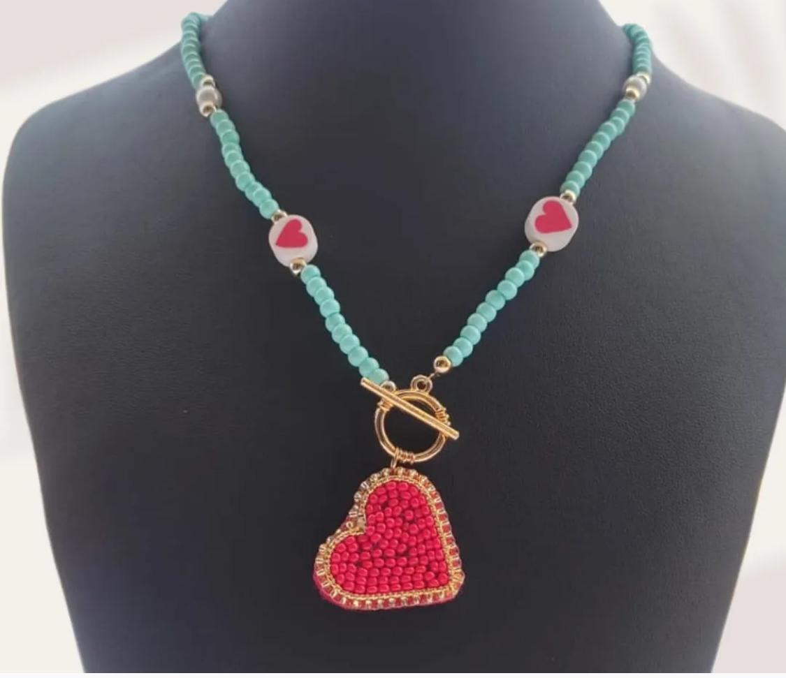 Handmade necklace woven in seed beads with woven heart detail